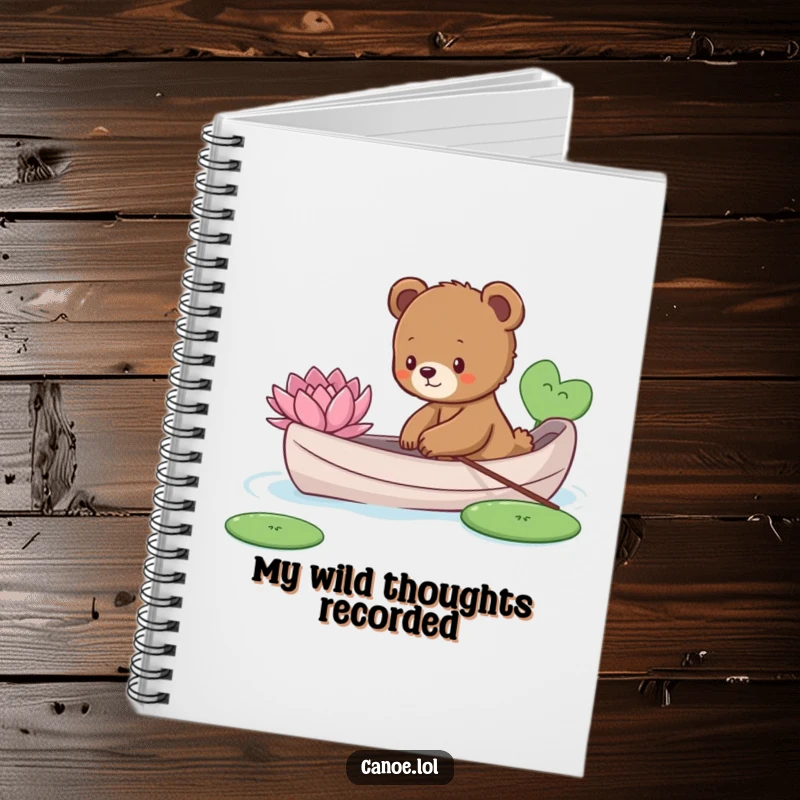 Funny curious bear cub reaching for a lily pad from a canoe, a humorous notebook for capturing ideas.