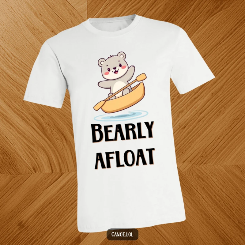 Funny happy bear balancing precariously while sitting in a canoe, a humorous t-shirt for adventurers.