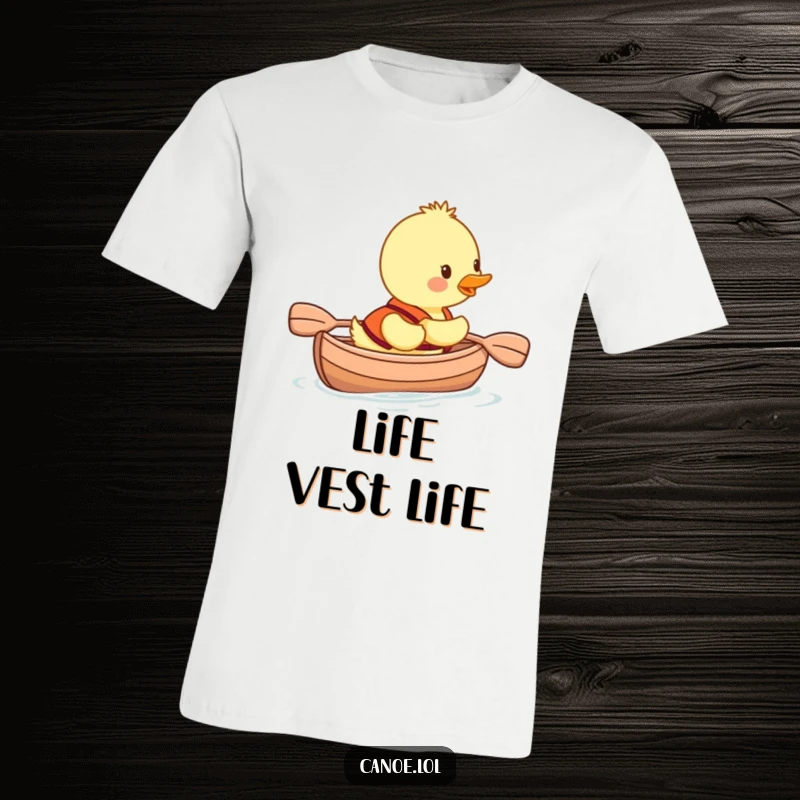 Funny duckling in a life vest smiling while paddling a canoe, a hilarious t-shirt for outdoor enthusiasts.